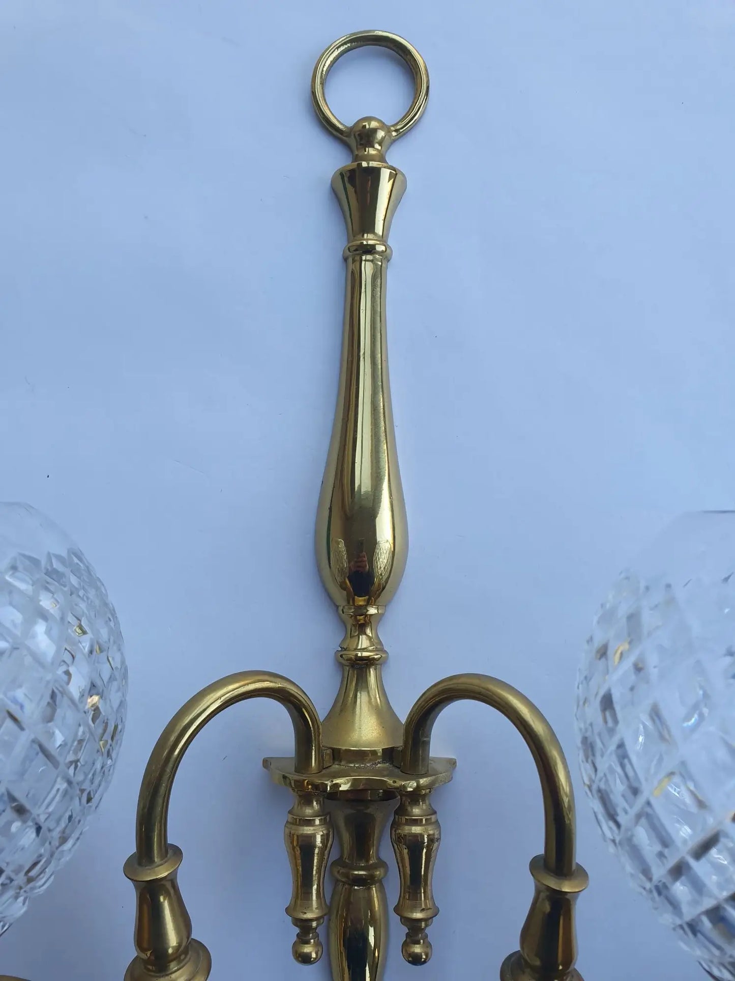 Two-light wall light golden with antique crystal globes