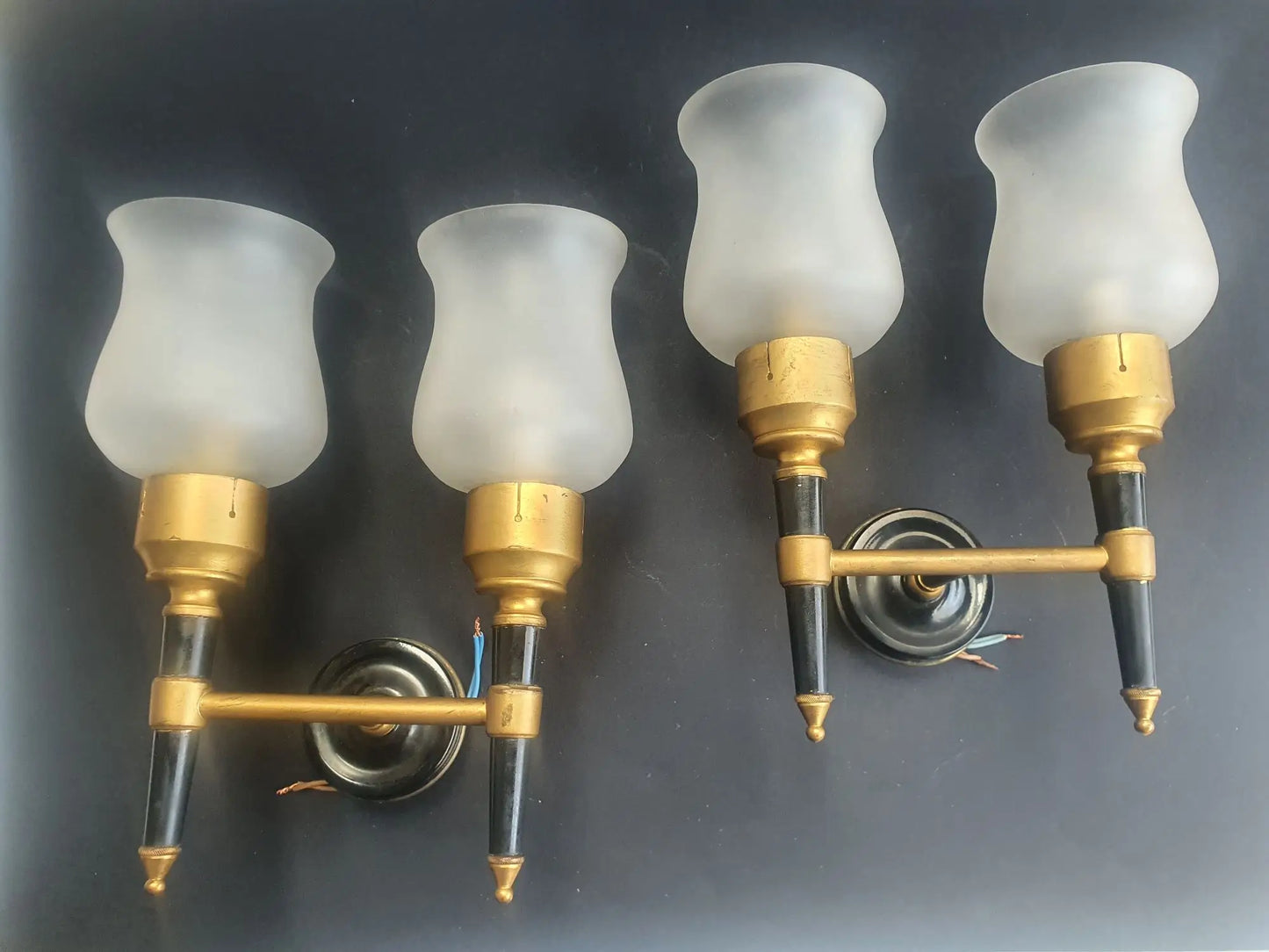 Paire d'appliques murales double lumières dorées flambeau style Empire